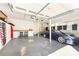 Spacious garage with work bench, rear entry door, and parking for one car at 1107 Fairfield Dr, Gastonia, NC 28054
