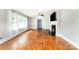 Open living area with hardwood floors, a fireplace, and plenty of natural light at 1107 Fairfield Dr, Gastonia, NC 28054