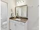 Bathroom featuring granite countertop vanity and framed mirror at 1132 Whitby Moore St, Charlotte, NC 28273