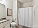 Clean bathroom featuring a white vanity, modern fixtures, and a shower at 1132 Whitby Moore St, Charlotte, NC 28273