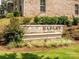 A beautifully landscaped community sign, nestled among lush greenery at 1132 Whitby Moore St, Charlotte, NC 28273