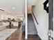 Open-concept floor plan with staircase, hardwood floors, and easy access to the kitchen at 1132 Whitby Moore St, Charlotte, NC 28273