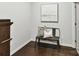 Stylish hallway features hardwood floors, bench seating and modern artwork at 1132 Whitby Moore St, Charlotte, NC 28273