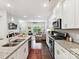 Modern open-concept kitchen with lots of storage, granite countertops, and stainless steel appliances at 1132 Whitby Moore St, Charlotte, NC 28273