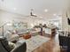 Bright open concept living room and modern kitchen with a seamless flow for entertaining at 1132 Whitby Moore St, Charlotte, NC 28273
