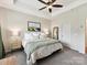 Spacious main bedroom featuring trey ceilings, ceiling fan and plush carpet at 1132 Whitby Moore St, Charlotte, NC 28273