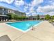 Spacious pool area surrounded by lounge chairs and beautifully landscaped buildings at 1132 Whitby Moore St, Charlotte, NC 28273