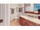 Clean bathroom featuring wooden vanity, tile floors, and neutral paint at 114 Caraway Ln, Mooresville, NC 28117