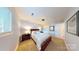 Inviting bedroom featuring neutral walls, plush carpeting, and natural light at 114 Caraway Ln, Mooresville, NC 28117