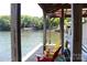 Covered boat dock with Adirondack chairs, perfect for lakeside relaxation and enjoying the peaceful scenery at 114 Caraway Ln, Mooresville, NC 28117
