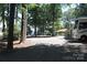 Wide gravel driveway with RV parking, offering convenient space and access to lakefront living at 114 Caraway Ln, Mooresville, NC 28117