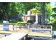 Lakefront property featuring a spacious deck area with grill, outdoor dining, and beautiful views at 114 Caraway Ln, Mooresville, NC 28117