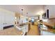 Updated kitchen with granite countertops, stainless steel appliances, and white cabinets for a clean and modern look at 114 Caraway Ln, Mooresville, NC 28117