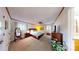 Comfortable bedroom with neutral carpet, a ceiling fan and warm natural light at 114 Caraway Ln, Mooresville, NC 28117