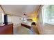 Bright main bedroom featuring a large bed, a window, and a dresser with a TV at 114 Caraway Ln, Mooresville, NC 28117