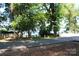 Street view featuring a glimpse of the lake and lush greenery, offering a serene environment at 114 Caraway Ln, Mooresville, NC 28117