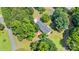 This angle shows the peaceful backyard bordered by trees and a long driveway offering seclusion and quiet at 125 Brasington Ln, Mooresville, NC 28115
