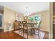 Bright dining area with large windows, stylish lighting, and seating for six, ideal for Gathering gatherings at 125 Brasington Ln, Mooresville, NC 28115