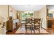 Dining room with hardwood floors, a modern chandelier, and a large window at 125 Brasington Ln, Mooresville, NC 28115