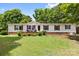 Inviting single-story home with well-maintained lawn and charming front porch at 125 Brasington Ln, Mooresville, NC 28115