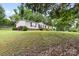 Charming single-story home with a detached garage on a spacious lot at 125 Brasington Ln, Mooresville, NC 28115