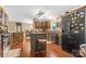 Well-equipped kitchen with dark wood cabinets, an island with stool seating, and stainless steel appliances at 125 Brasington Ln, Mooresville, NC 28115