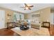 Cozy living room featuring a neutral palette, hardwood floors and a ceiling fan at 125 Brasington Ln, Mooresville, NC 28115