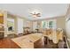 Welcoming living room featuring hardwood floors, a ceiling fan, and ample natural light at 125 Brasington Ln, Mooresville, NC 28115