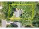 Aerial view of home with mature trees surrounding property, showing roof and driveway at 12524 Angel Oak Dr, Huntersville, NC 28078