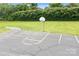Enjoy a private basketball court in a lush green yard with mature landscaping at 12524 Angel Oak Dr, Huntersville, NC 28078
