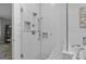 Walk-in shower with patterned tile and a built-in niche for toiletries at 12524 Angel Oak Dr, Huntersville, NC 28078