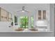 Cozy breakfast nook features views of the backyard, counter seating, and glass faced cabinetry at 12524 Angel Oak Dr, Huntersville, NC 28078