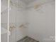 Walk-in closet with metal shelving for optimal storage solutions at 12524 Angel Oak Dr, Huntersville, NC 28078
