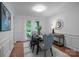 Elegant dining room with hardwood floors, wainscoting, and natural light at 12524 Angel Oak Dr, Huntersville, NC 28078