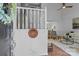 Bright foyer with staircase, coat rack, and view into the living room at 12524 Angel Oak Dr, Huntersville, NC 28078