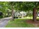 Charming home with a well-manicured lawn, mature trees and a classic front facade at 12524 Angel Oak Dr, Huntersville, NC 28078