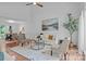 Open-concept living room with hardwood floors, neutral decor, and plenty of natural light at 12524 Angel Oak Dr, Huntersville, NC 28078