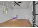 Bright, clean interior of an outbuilding with white walls, a ceiling fan and door to the exterior at 12524 Angel Oak Dr, Huntersville, NC 28078