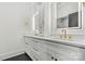 Bright bathroom with double vanity, marble countertops and gold fixtures at 130 Broken Arrow Dr, Statesville, NC 28677
