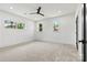 Carpeted bedroom featuring neutral color palette and abundant natural light from multiple windows at 130 Broken Arrow Dr, Statesville, NC 28677