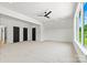 Bright bedroom with multiple closets, neutral carpet and a ceiling fan at 130 Broken Arrow Dr, Statesville, NC 28677