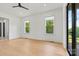 Bright bedroom with hardwood floors and two large windows offering natural light at 130 Broken Arrow Dr, Statesville, NC 28677