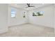 This bedroom features a neutral carpet, three windows and recessed lighting at 130 Broken Arrow Dr, Statesville, NC 28677