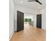 Empty bedroom with hardwood floors and black double doors at 130 Broken Arrow Dr, Statesville, NC 28677