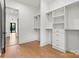 Spacious walk-in closet with custom built-in shelving and drawers at 130 Broken Arrow Dr, Statesville, NC 28677