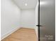 This is a small, empty closet with hardwood floors and white walls at 130 Broken Arrow Dr, Statesville, NC 28677