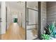 Bright foyer with natural wood floors, white walls, and a view of the home's modern interior at 130 Broken Arrow Dr, Statesville, NC 28677