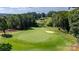 Scenic golf course view featuring manicured greens and a sand bunker, perfect for golf enthusiasts at 130 Broken Arrow Dr, Statesville, NC 28677