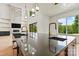 Bright modern kitchen featuring dual sinks, stainless steel dishwasher, and views of the yard at 130 Broken Arrow Dr, Statesville, NC 28677
