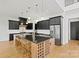 Modern kitchen featuring a large island with seating, stainless steel appliances, and custom cabinetry at 130 Broken Arrow Dr, Statesville, NC 28677
